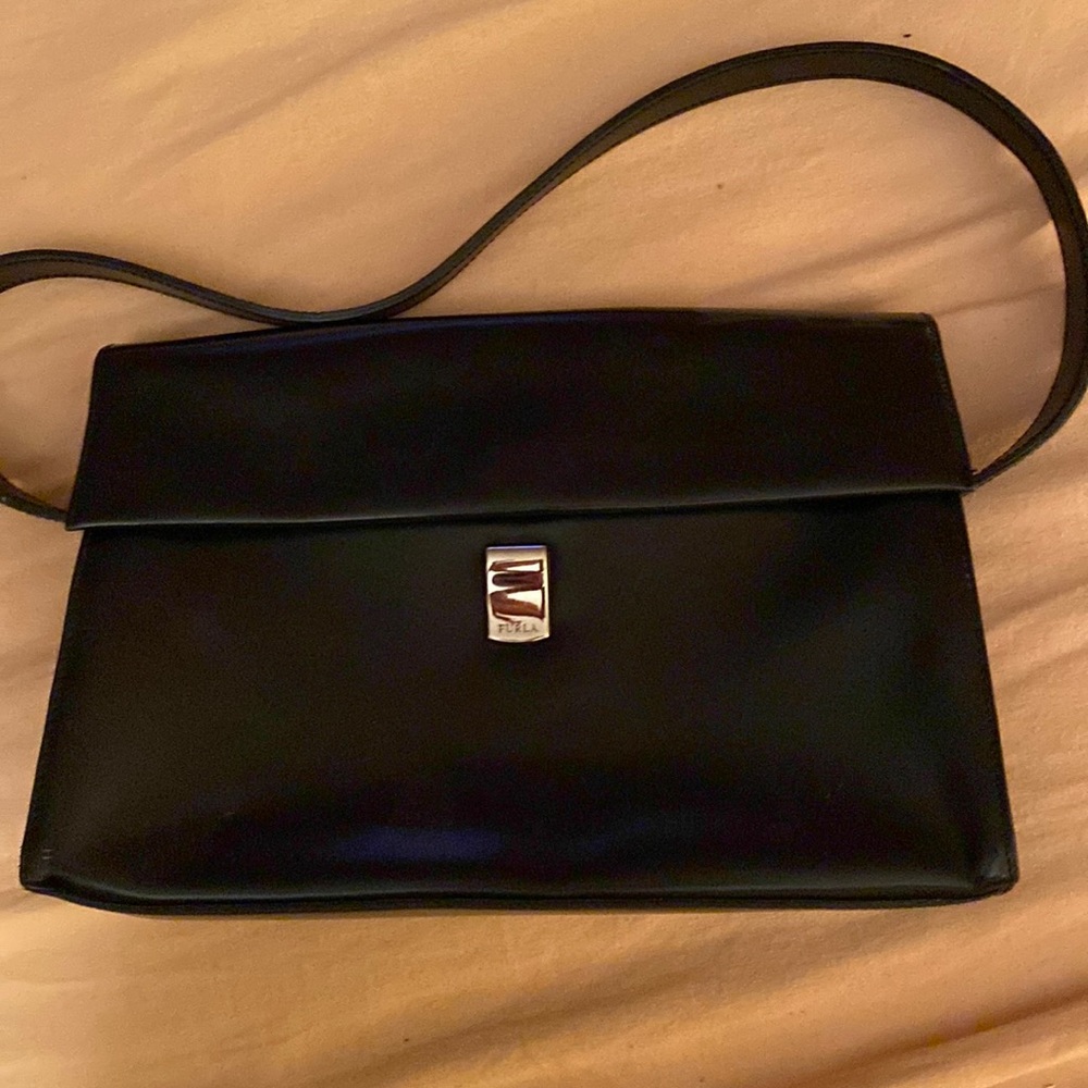 Black designer handbag. Furla.